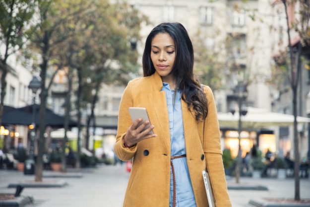 Portrait of Latin business woman on street