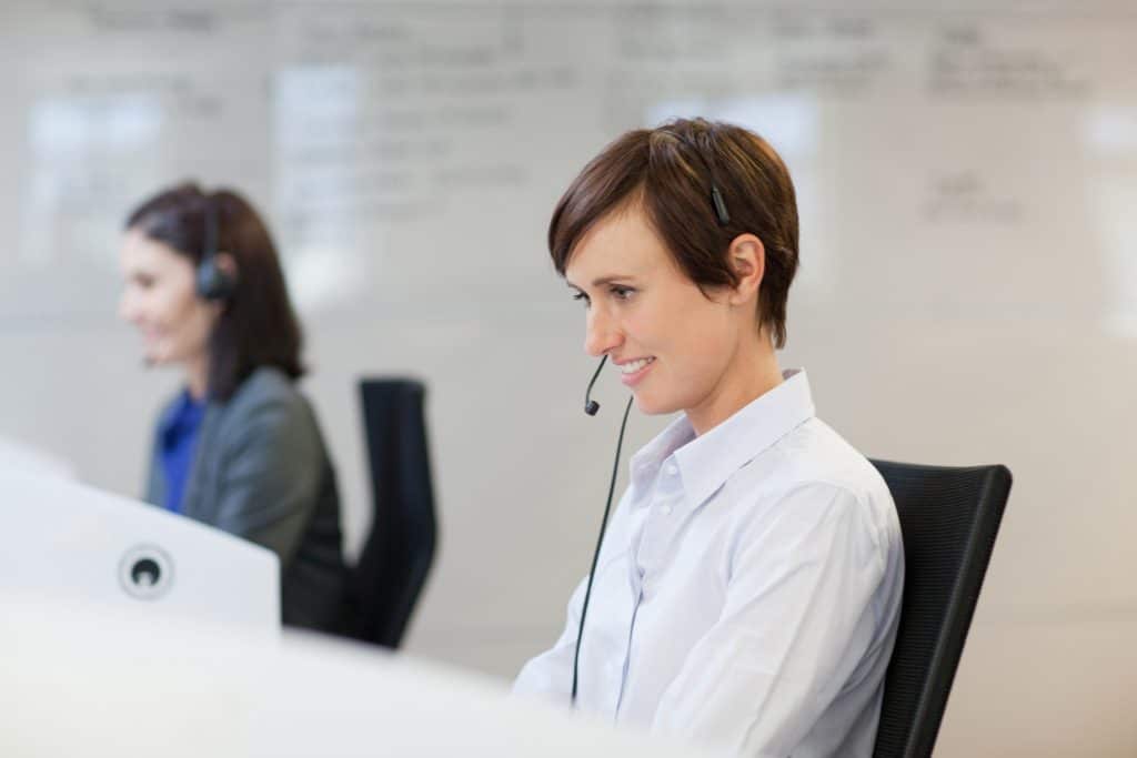 Portrait of smiling woman wearing headset