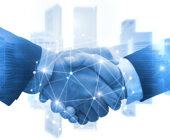 Partnership - business man shaking hands with effect digital network link connection graphic diagram, digital global technology with cityscape background, internet communication and teamwork concept